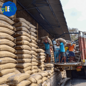 "A group of employees from The Indian Export Company unloading a truck of freshly harvested Indian cereals, pulses, dry fruits, vegetables, and sugar, which are all renowned for their quality and taste. The company is a leading Indian exporter with a strong reputation for providing customers with high-quality products. The products are sourced from their own farms, ensuring complete control over the production process. The company's commitment to excellence has earned them a loyal customer base across the globe."